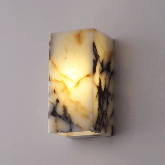 Black marble stone wall lamp with warm LED glow, perfect for luxury bedroom sconce or bathroom accent lighting.