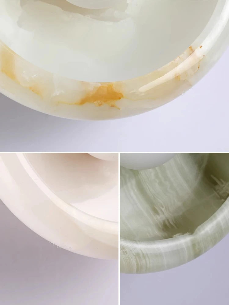 Close-up of Jade Wall Lamp textures in green, white, and cream marble, showcasing premium craftsmanship and luxury material details.