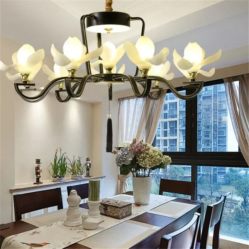 Retro Magnolia Flower Pendant Light with 9 floral LED lamps in black frame, perfect for dining room ambiance and elegant interior design.
