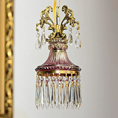 Retro French crystal chandelier with gold scroll arms and pink glass, luxury pendant light for vintage-style interiors.