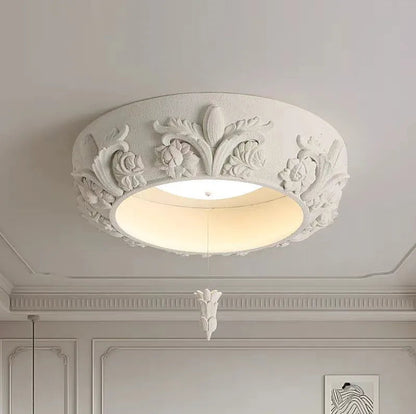 Flush-mounted carved plaster chandelier - french farmhouse ceiling light featuring ornate floral patterns and soft LED glow.
