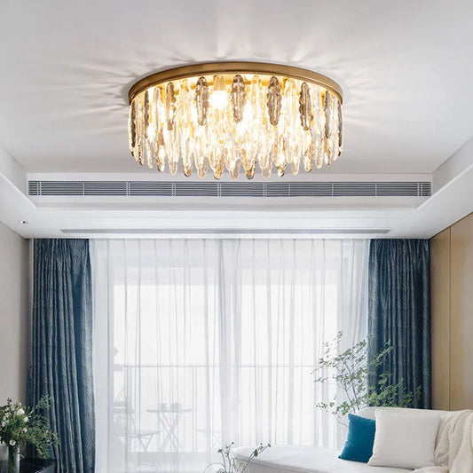 French Golden Modern Chandelier - Modern French Crystal ceiling light with gold finish and crystal drops, ideal for living rooms or lounges.