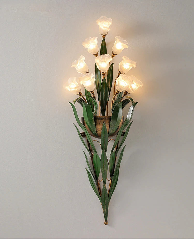 Large French country wall light with white floral bulbs and layered green leaves, ideal for vintage home lighting accents.