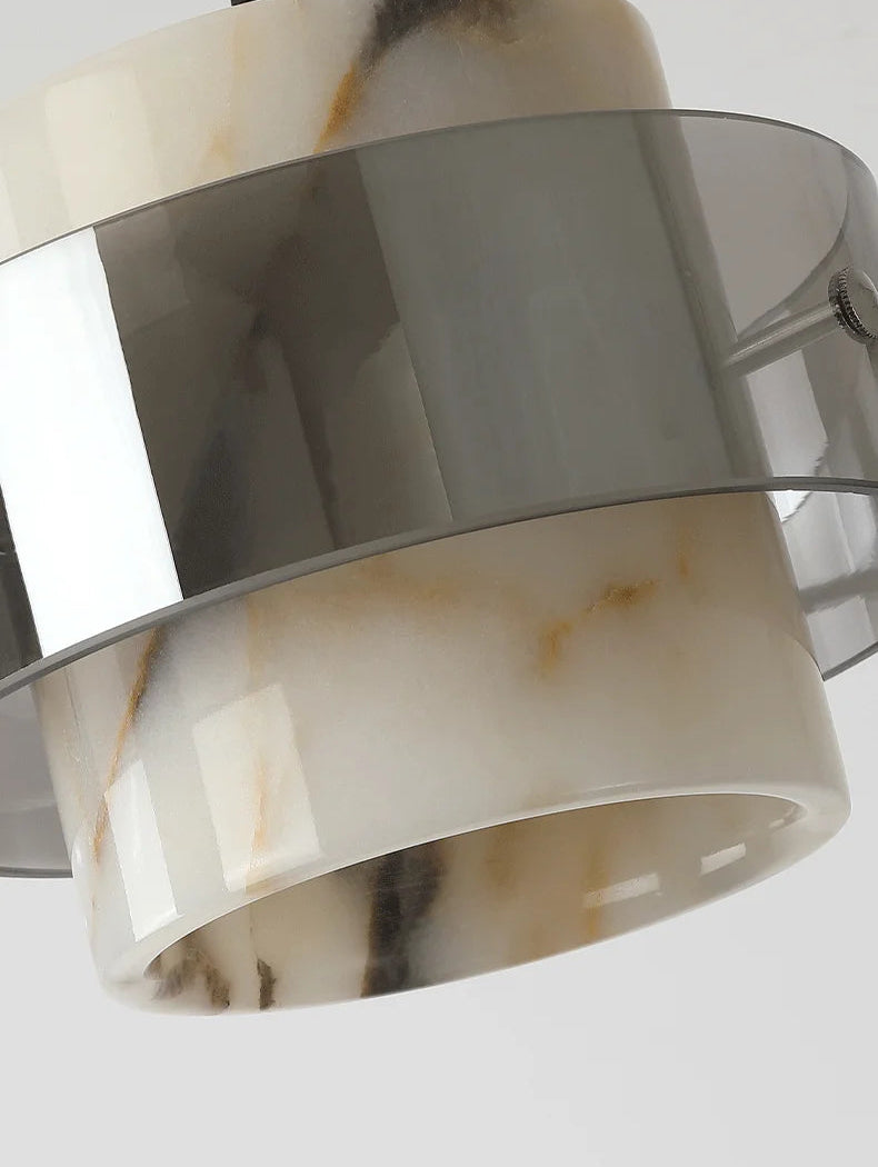 Product detail of the Stone Drop Pendant - LED Marble Light showcasing its elegant stone texture and smoked glass band.