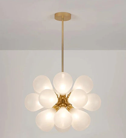 Modern white bubble glass chandelier with golden lampbody, perfect for Nordic-inspired interior lighting.