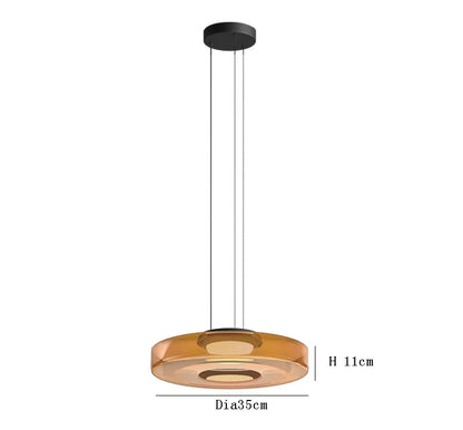 Amber glass pendant light with 35cm diameter and 11cm height. LED lighting and adjustable hanging wire for kitchen decor.