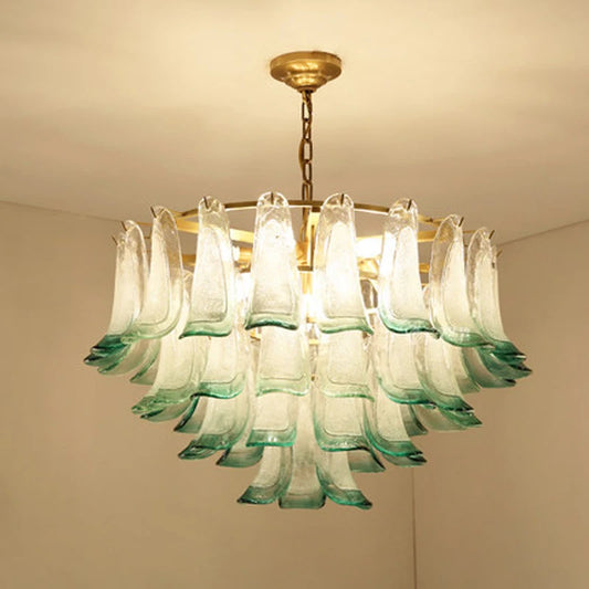 Modern luxury glass chandelier with layered green-tinted crystal petals and gold frame, ideal for elegant home lighting decor.