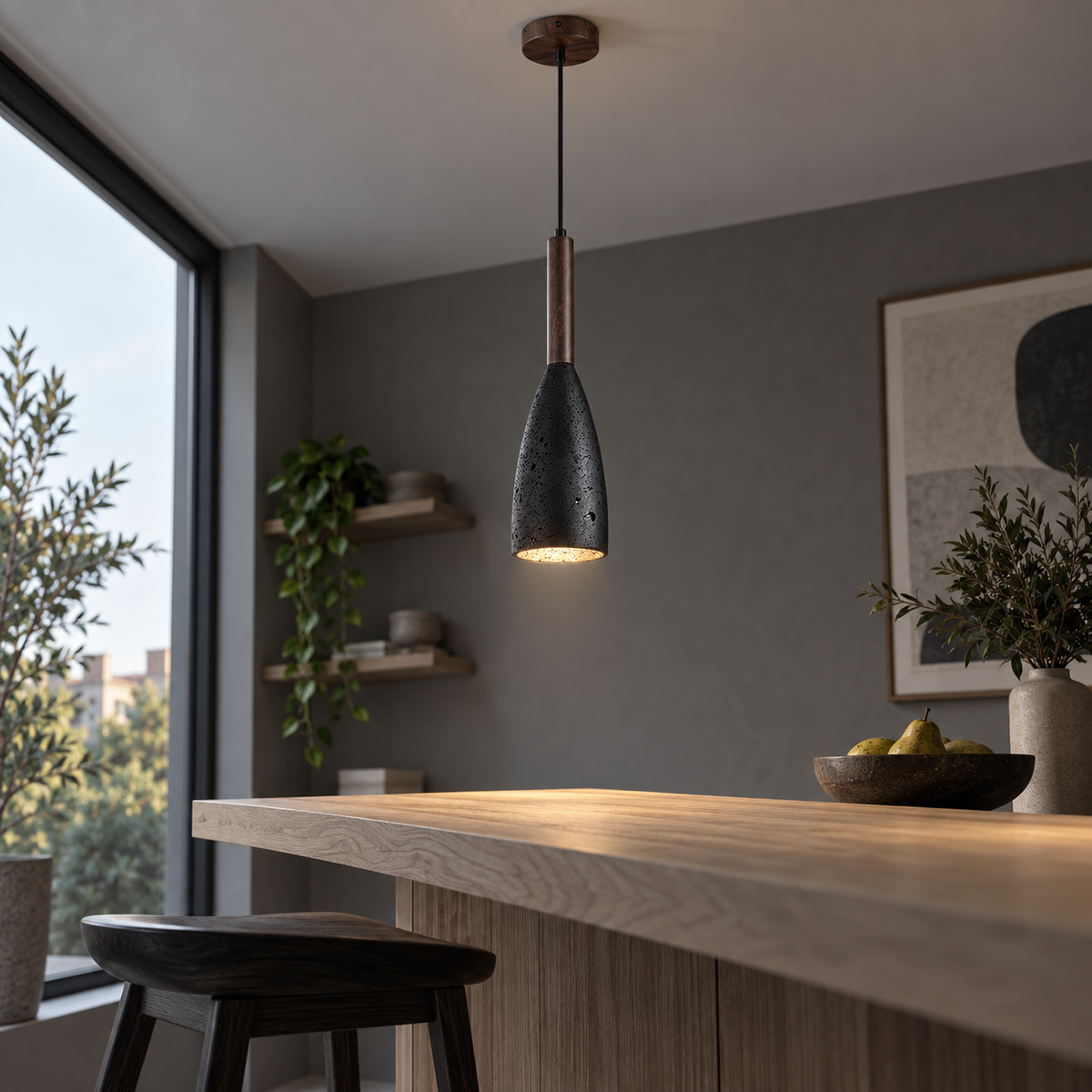 Low angle view of the black stone pendant installed above a breakfast counter