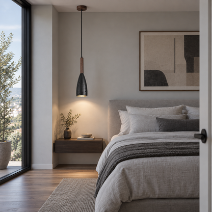 Black stone pendant with walnut accent installed in a modern bedroom