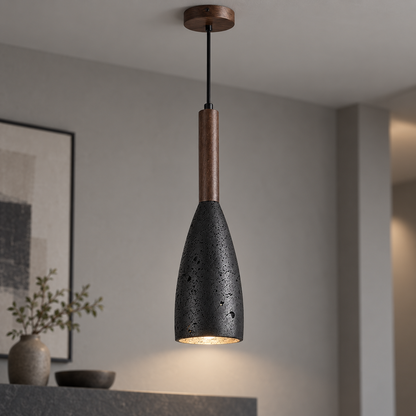 Commercial view of the black stone and walnut pendant light switched on