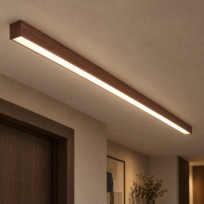 120 cm dark reddish brown walnut-grain effect ceiling bar light installed in a contemporary interior