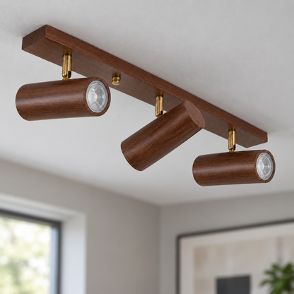 Walnut 3-light adjustable cylinder spotlights installed in a contemporary interior