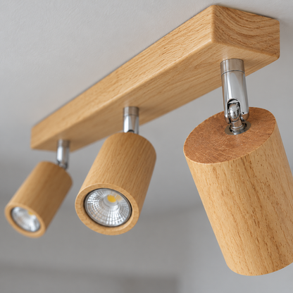 Natural wood spotlight and chrome pivot detail