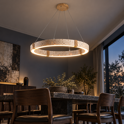 Low angle room view of the illuminated underside of the travertine ring pendant