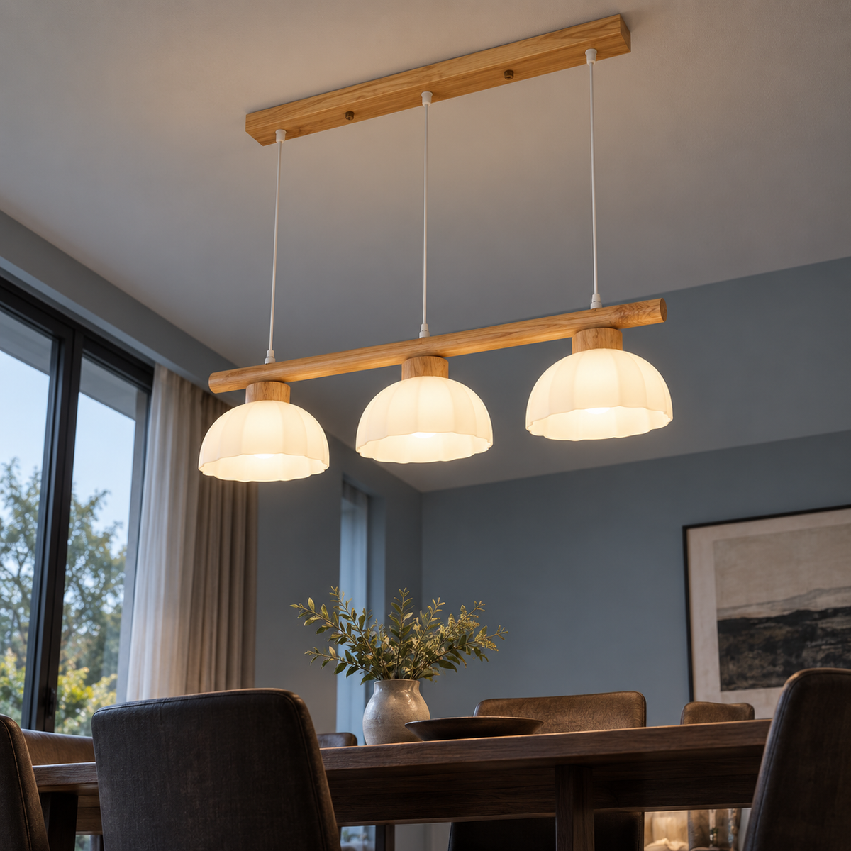 Low angle view beneath the three white glass domes of the wood pendant