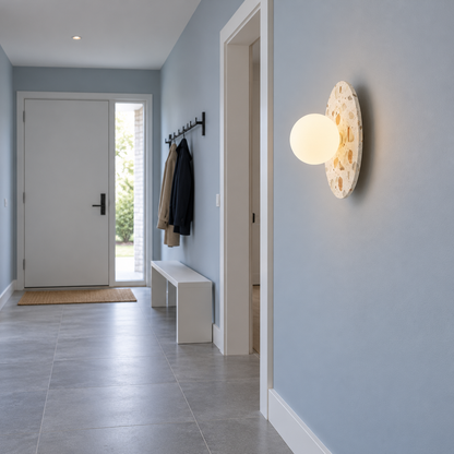 Terrazzo disc wall light with a frosted glass globe — side far, White