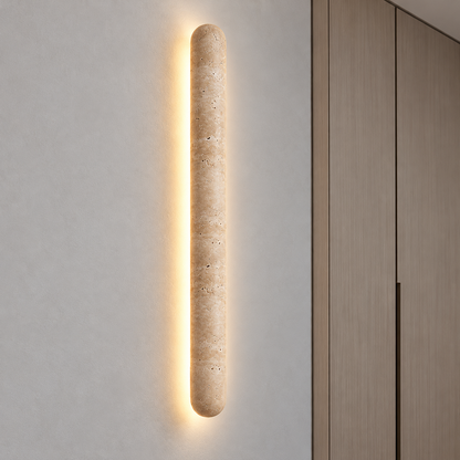 Capsule travertine wall light with a soft halo — commercial, Yellow-beige / Length 90 cm
