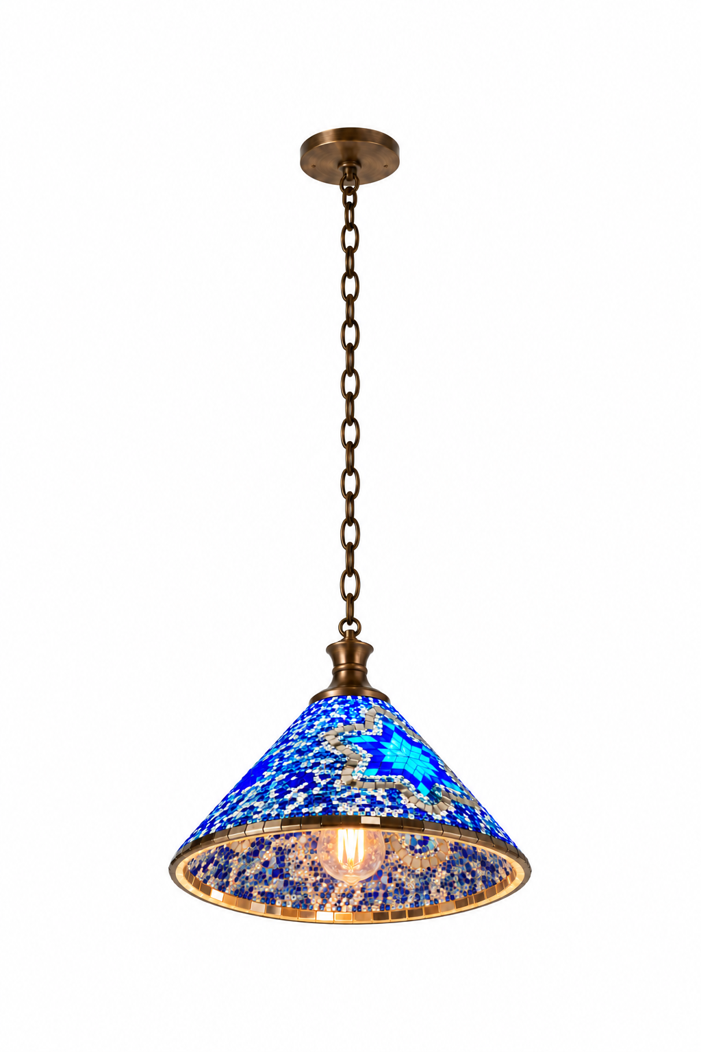 Blue Style A mosaic cone pendant, illuminated from a low opposing view against a clean near-white backdrop, with its inner cone and complete bronze canopy and chain visible.