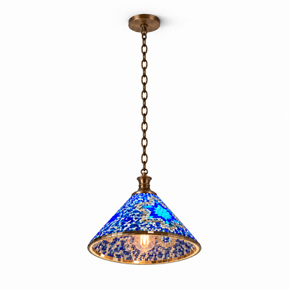 Blue Style A mosaic cone pendant, illuminated from a low opposing view against a clean near-white backdrop, with its inner cone and complete bronze canopy and chain visible.