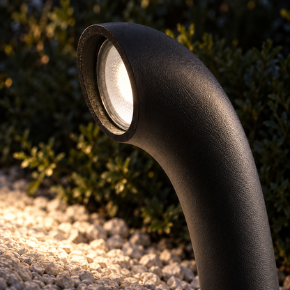 Curved aluminium path light with a downward glow — Black - Round base, edge on optic macro attempt1, illuminated