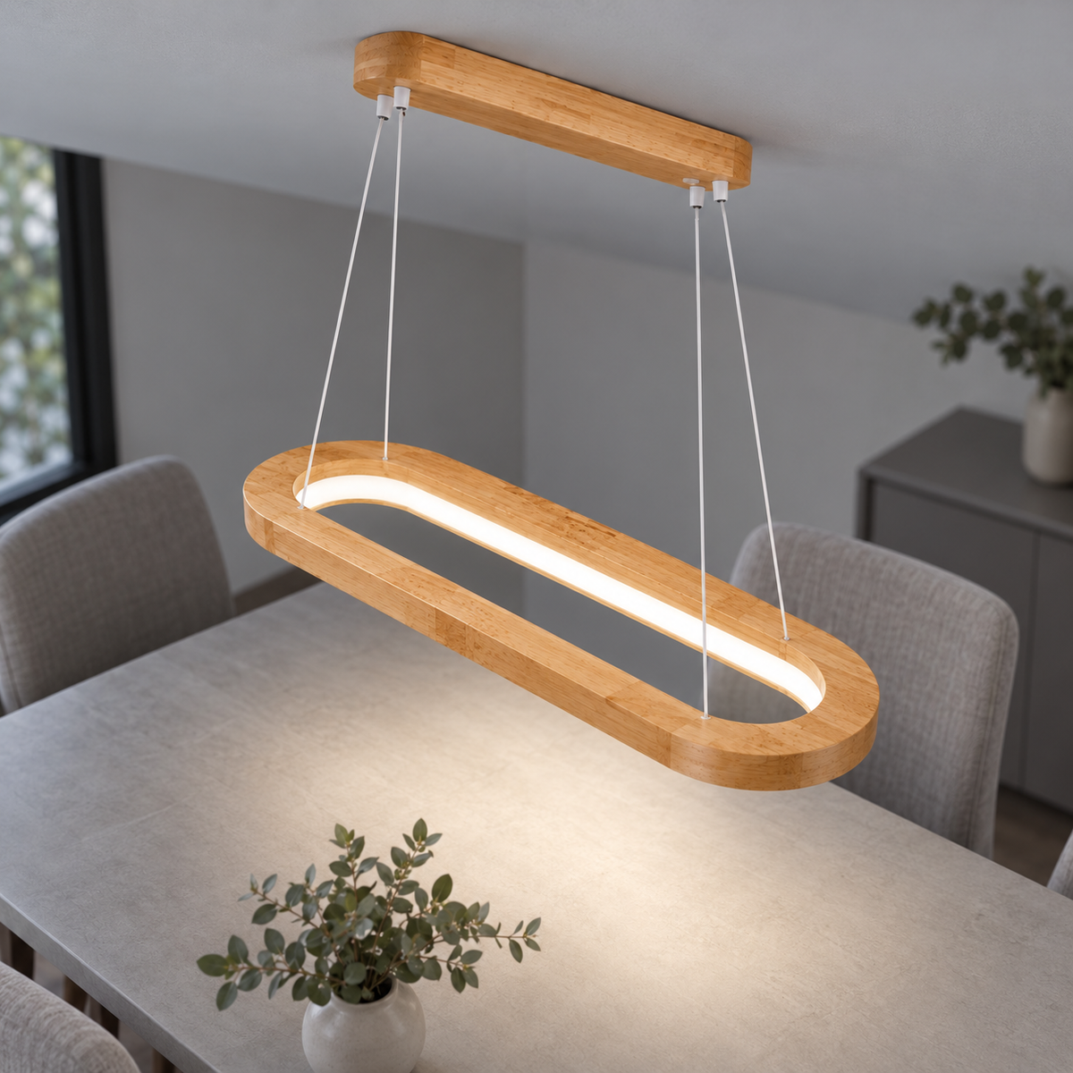 Illuminated 60cm light-wood oval pendant in a centered elevated commercial view
