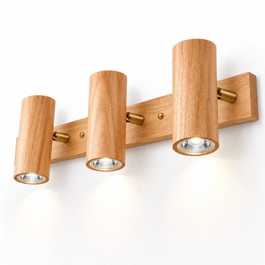 Beige rubberwood wall spotlight with three illuminated cylinders and brass pivots, 50 cm
