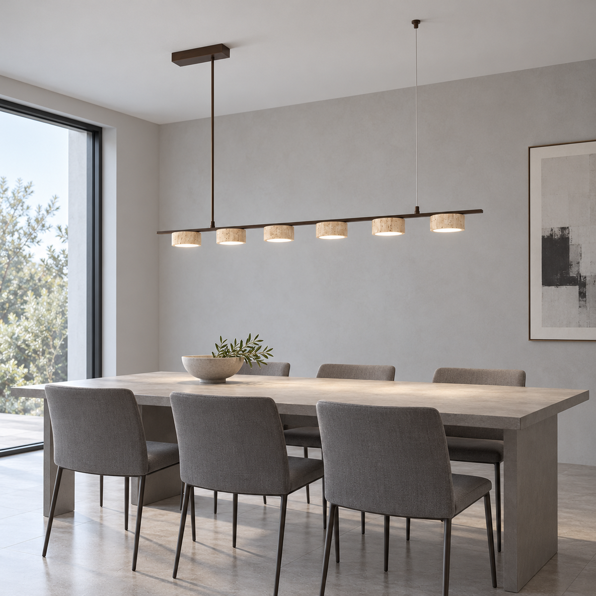 Six illuminated shallow travertine shades on bronze linear pendant installed in neutral grey dining room