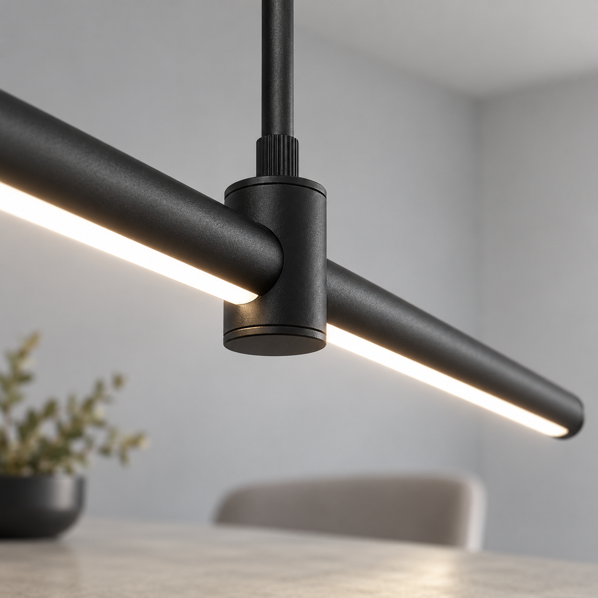 Sleek aluminium pendant with an adjustable stem — Black, joint detail, illuminated and faithfully mounted.
