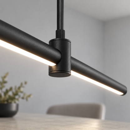 Sleek aluminium pendant with an adjustable stem — Black, joint detail, illuminated and faithfully mounted.