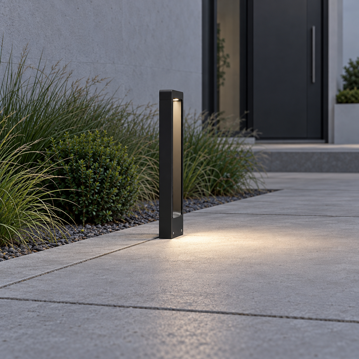 Open frame aluminium garden bollard light — Black, side far, illuminated and faithfully mounted.