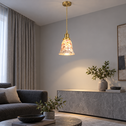 Iridescent shell bell pendant lit above a grey console, seen from a far front-side position showing the whole room.