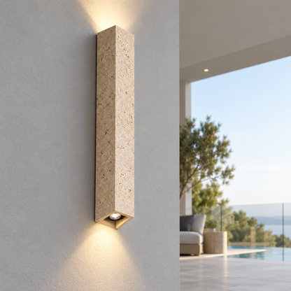 60 cm travertine wall light illuminated, centered commercial view from the lower left side