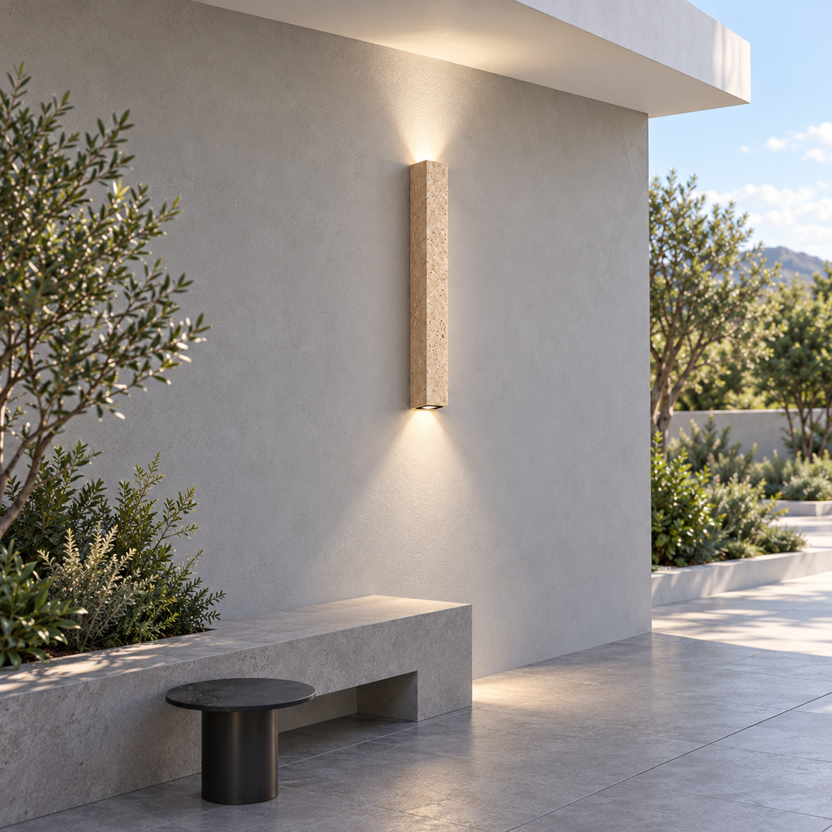 80 cm natural travertine twin-beam wall light illuminated in a minimalist outdoor seating area