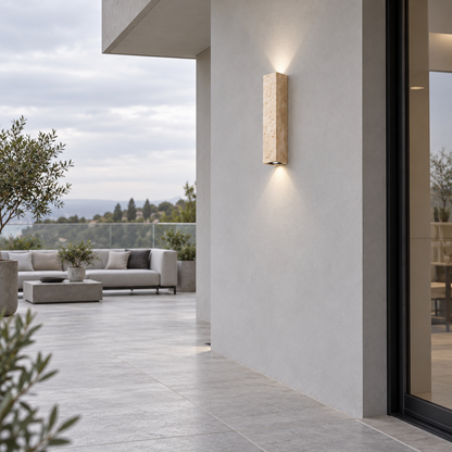 40 cm travertine twin-beam wall light, illuminated in a modern courtyard from a distant side view