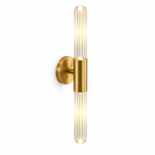 Clear fluted glass and gold wall light, illuminated, photographed from above the front-left on white.