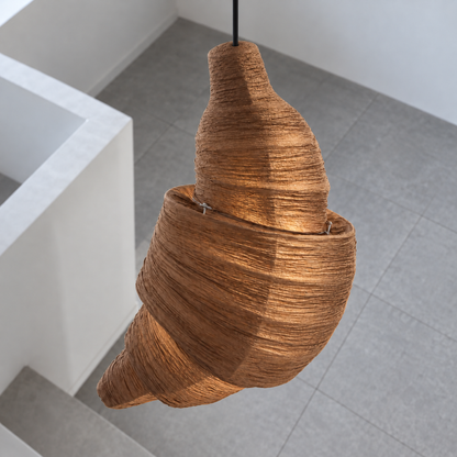 Croissant-shaped fabric pendant light — above mid, coffee