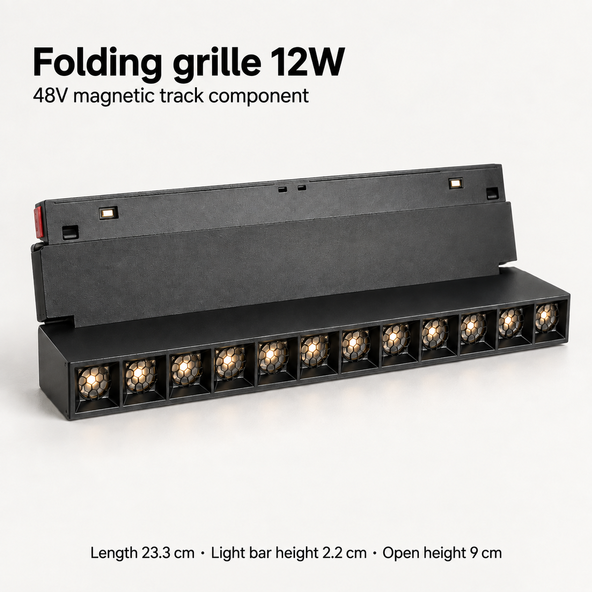 Black 12W folding grille magnetic track light component showing 12 honeycomb optics, hinged mounting plate and dimensions