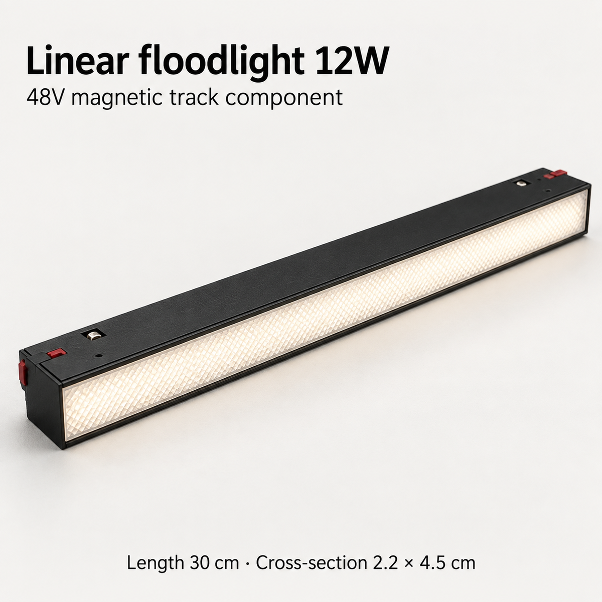 Black 12W linear floodlight for a 48V magnetic track, showing the prismatic diffuser and 30 cm length.