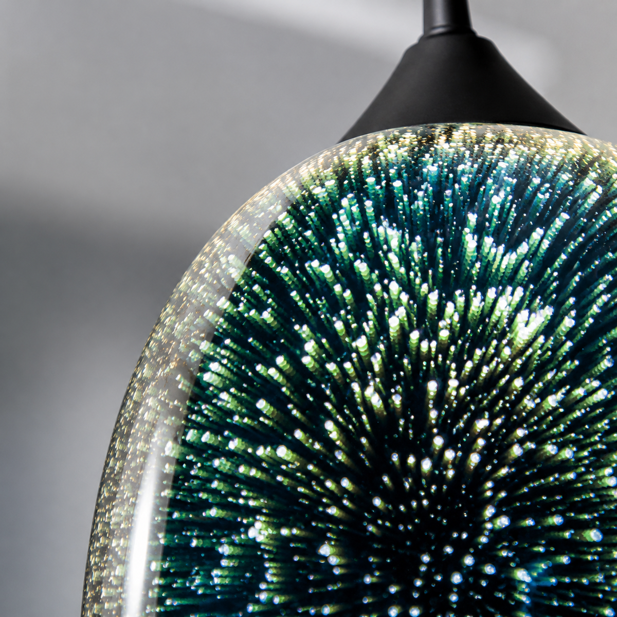 Close-up of the 3D fireworks optical effect inside the mirrored glass pendant