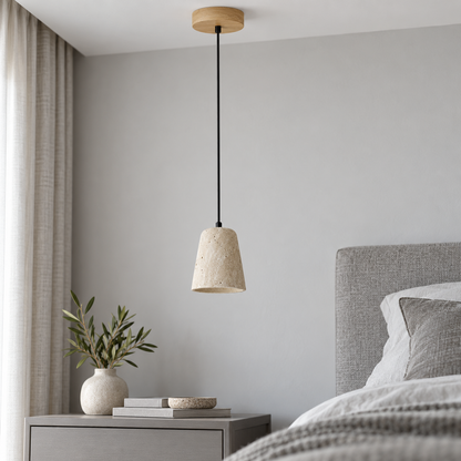Single travertine pendant with beige wood ceiling canopy, installed in a neutral daylight bedroom