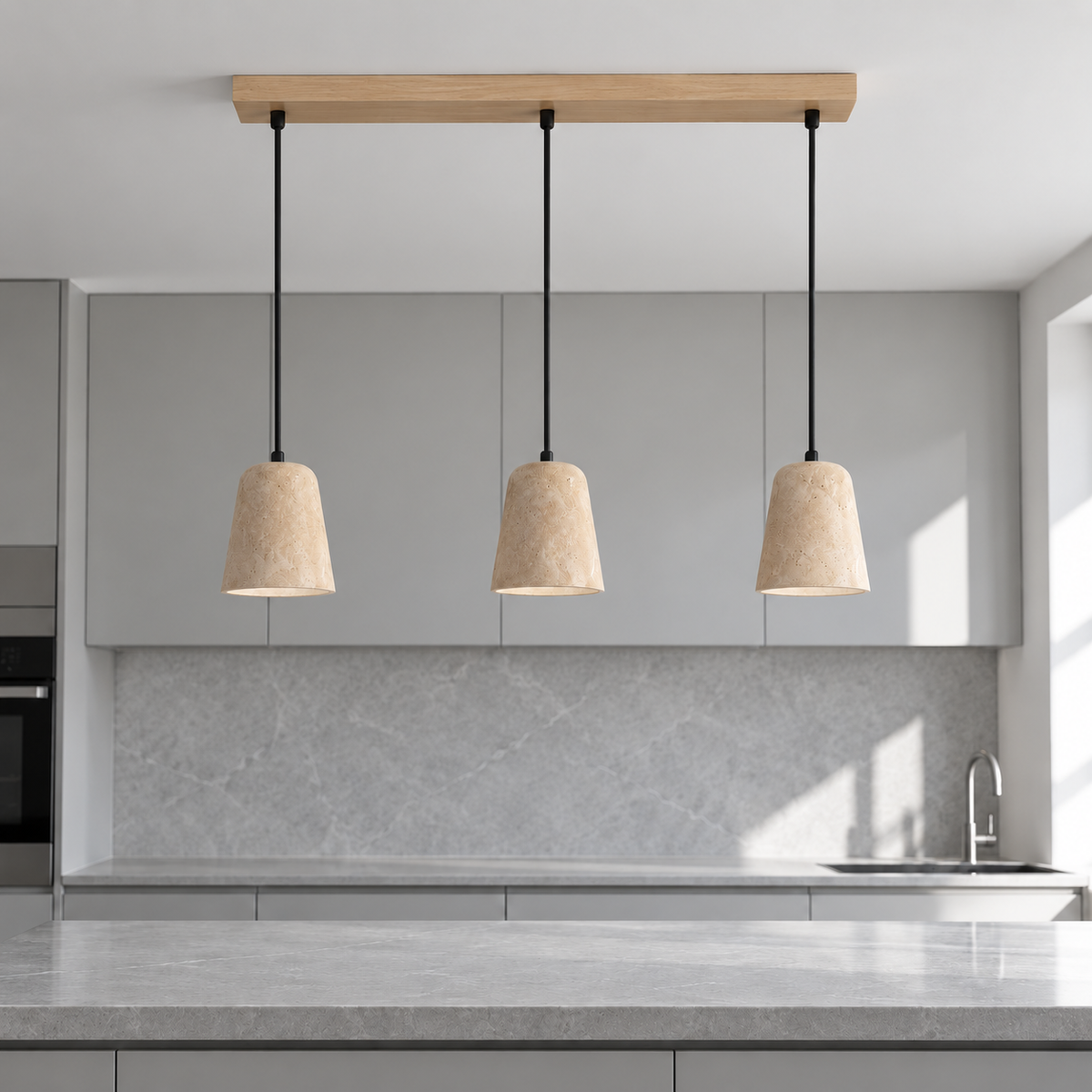 Three matching travertine shades with Beige wood ceiling bar above a modern gray kitchen island