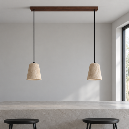 Two travertine pendants with walnut wood ceiling bar installed above a neutral work surface