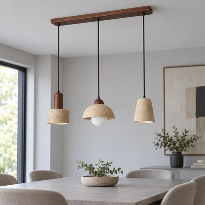 Three mixed travertine pendant shades with walnut wood ceiling bar, installed in a neutral daylight dining room