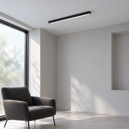 Black 50 cm aluminium ceiling bar in a simple neutral daylight reading corner