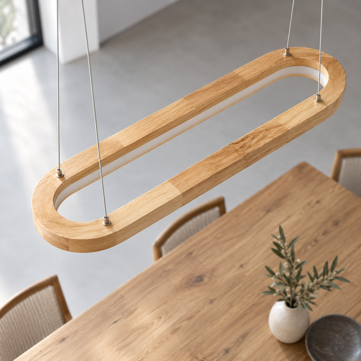 Elevated detail of the 90 cm solid wood oval pendant, showing its upper rim and four suspension cables