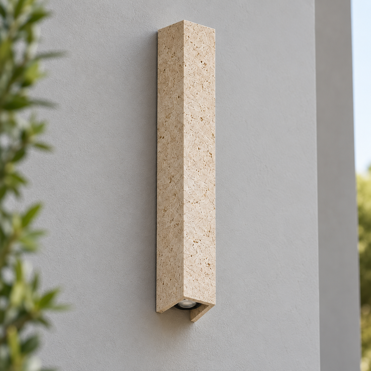 60 cm travertine outdoor wall light on a light gray wall, switched off