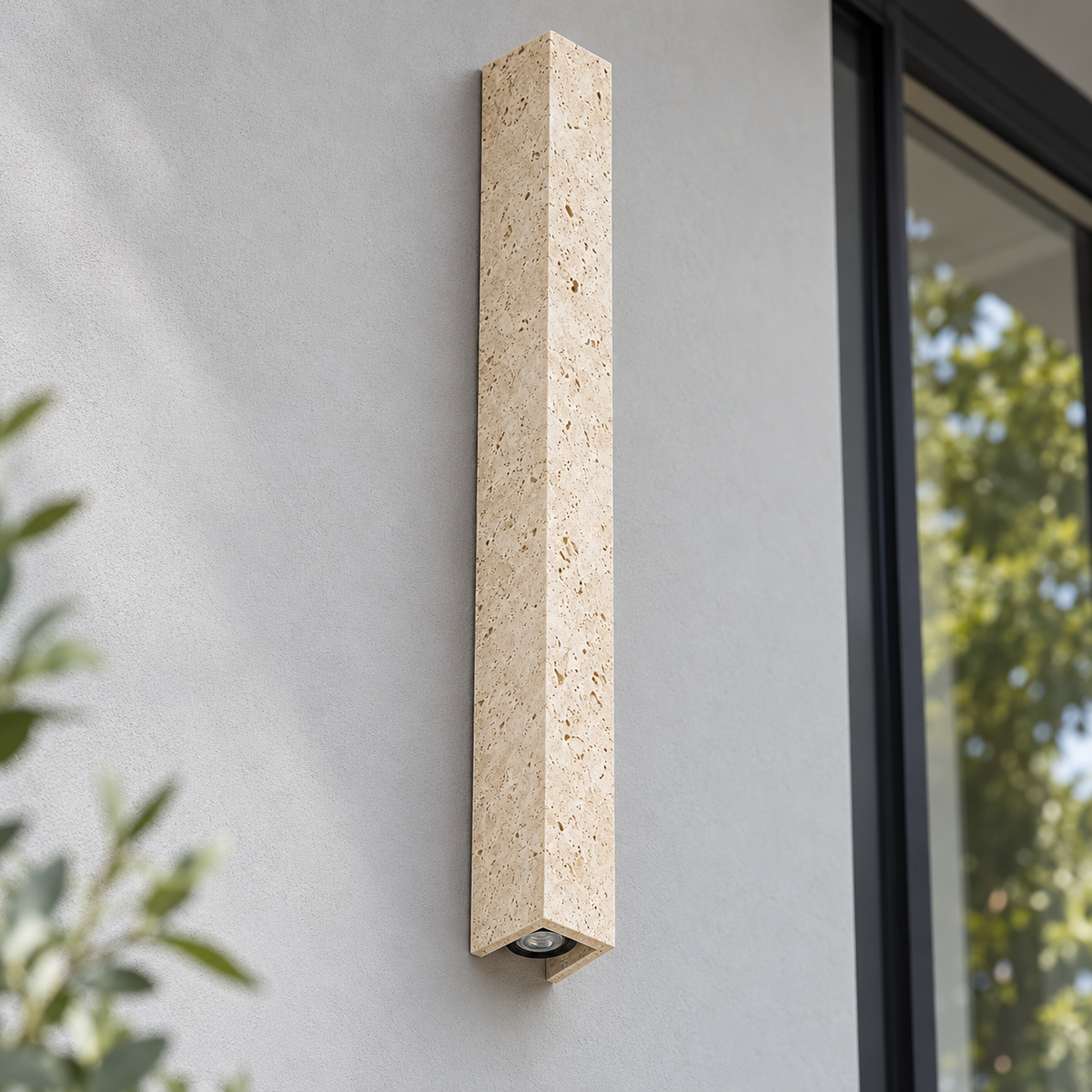80 cm travertine outdoor wall light installed on a light gray wall, switched off