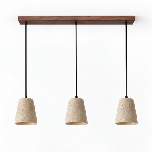 Three matching travertine pendant shades with walnut wood ceiling bar on a white catalog background
