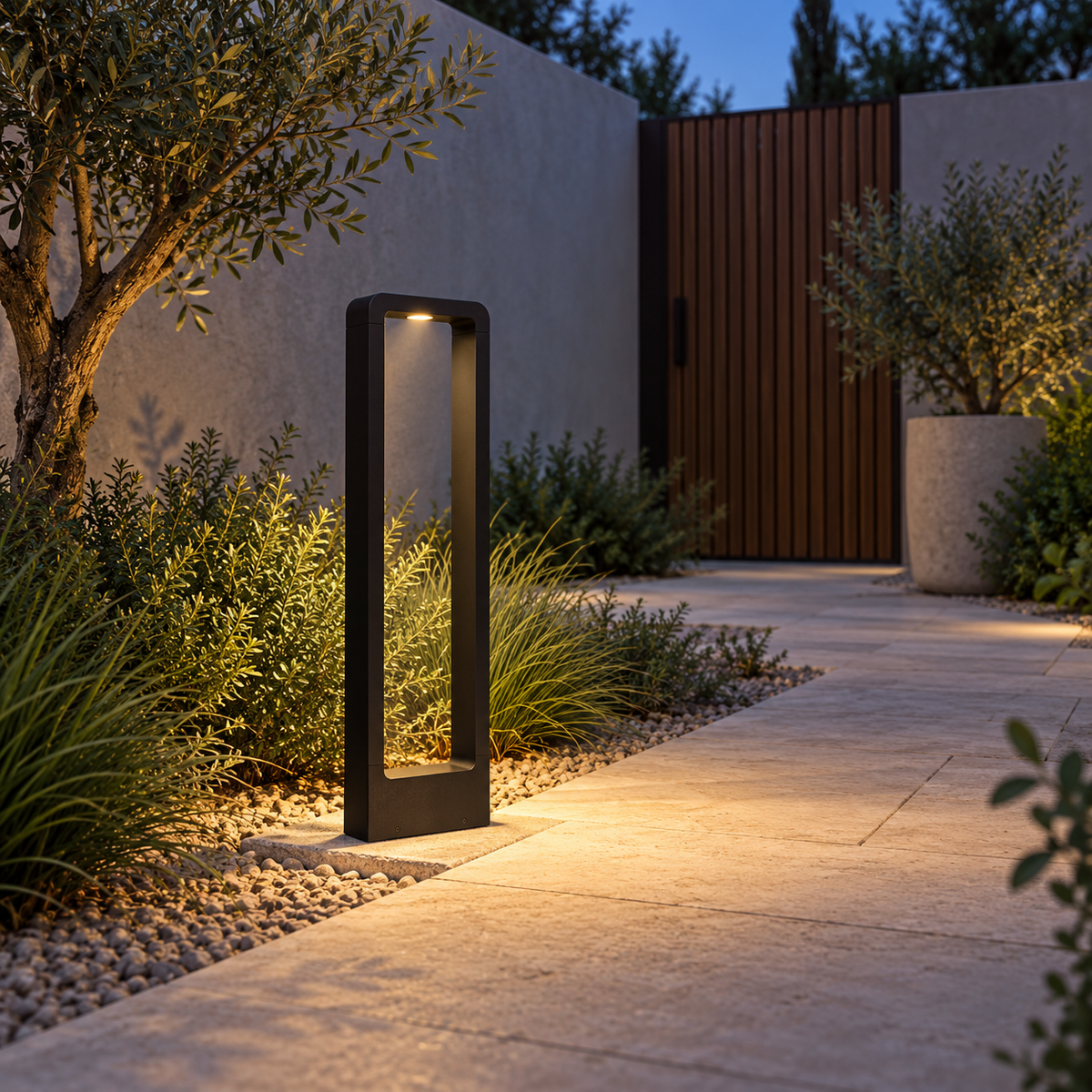 Front view of a black frame garden bollard beside a courtyard path