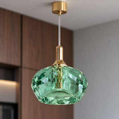 Green faceted crystal pendant, close view of facets and gold fitting